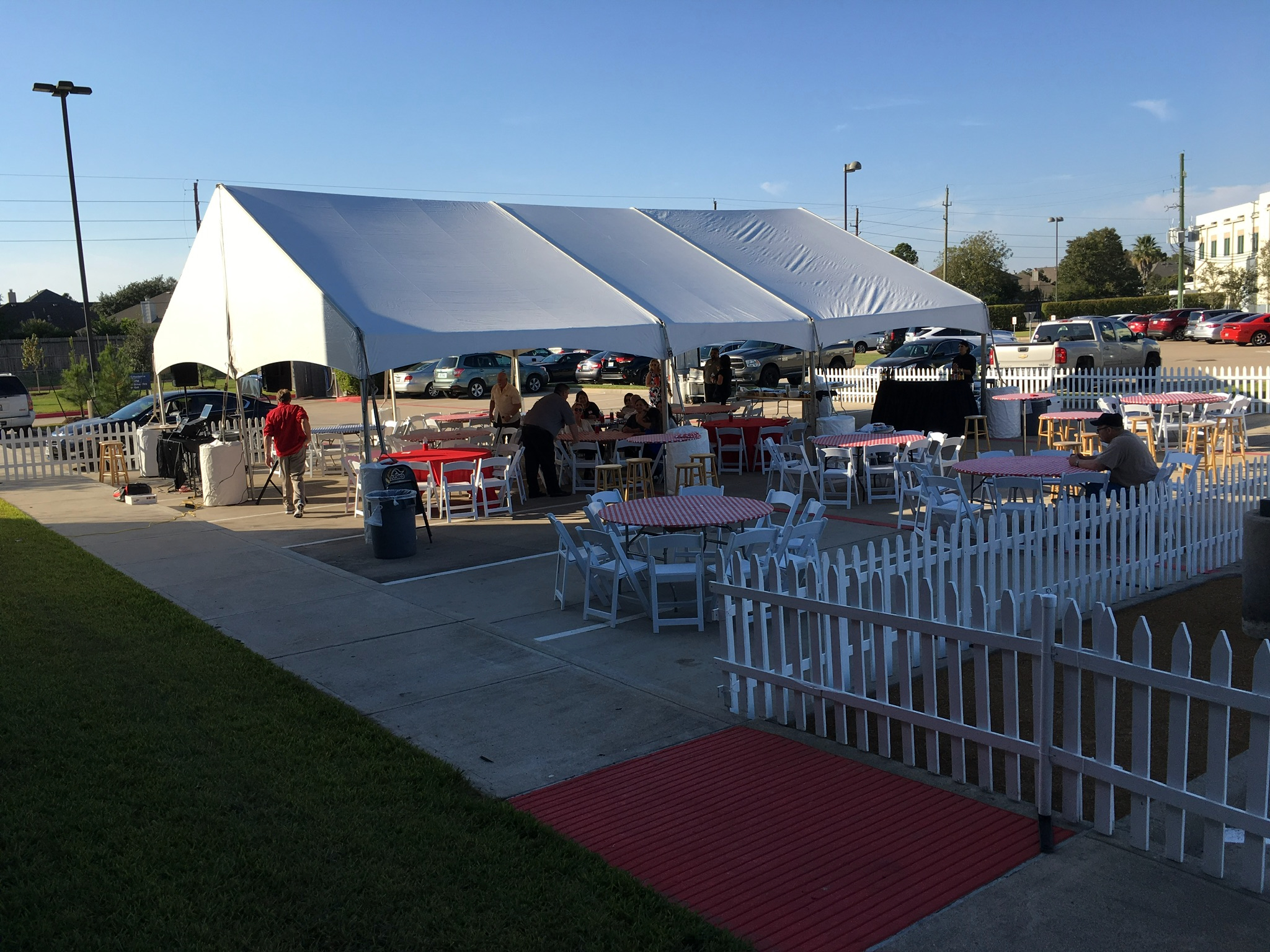 Chiavari chairs staged under a tent ahead of a Houston event